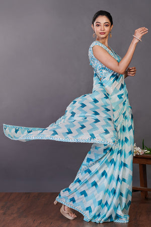 Buy aqua blue printed satin sequin work sari online in USA with blouse. Make a fashion statement on festive occasions and weddings with designer sarees, designer suits, Indian dresses, Anarkali suits, palazzo suits, designer gowns, sharara suits, embroidered sarees from Pure Elegance Indian fashion store in USA.-pallu