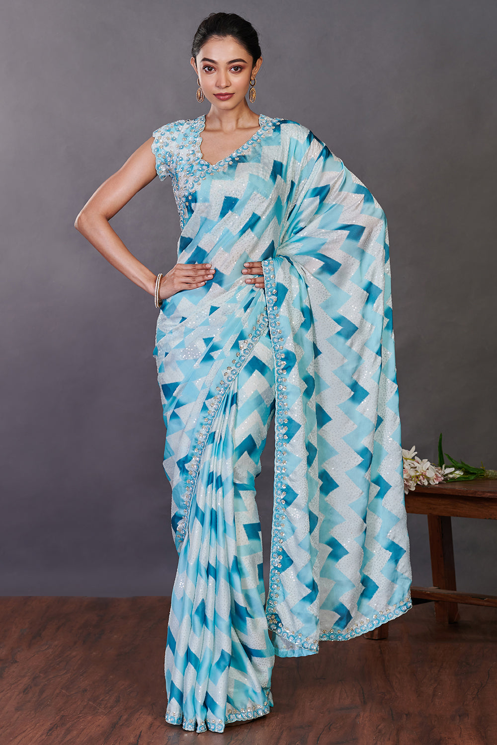 Buy aqua blue printed satin sequin work sari online in USA with blouse. Make a fashion statement on festive occasions and weddings with designer sarees, designer suits, Indian dresses, Anarkali suits, palazzo suits, designer gowns, sharara suits, embroidered sarees from Pure Elegance Indian fashion store in USA.-full view