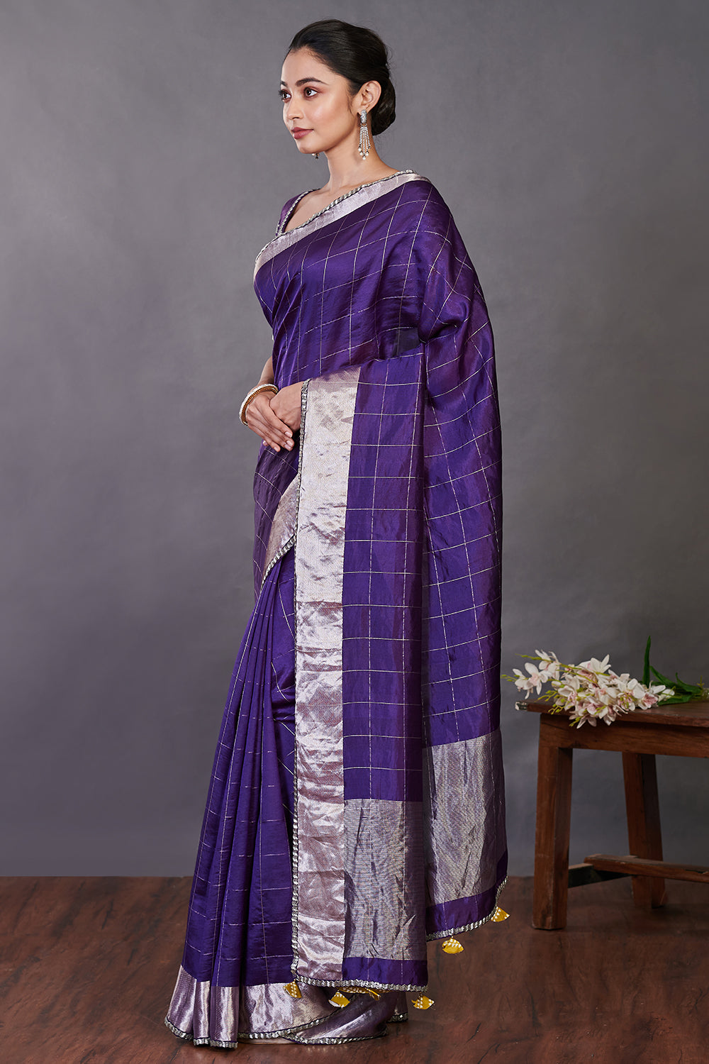 Shop purple zari check handloom sari online in USA with blouse. Make a fashion statement on festive occasions and weddings with designer sarees, designer suits, Indian dresses, Anarkali suits, palazzo suits, designer gowns, sharara suits, embroidered sarees from Pure Elegance Indian fashion store in USA.-pallu