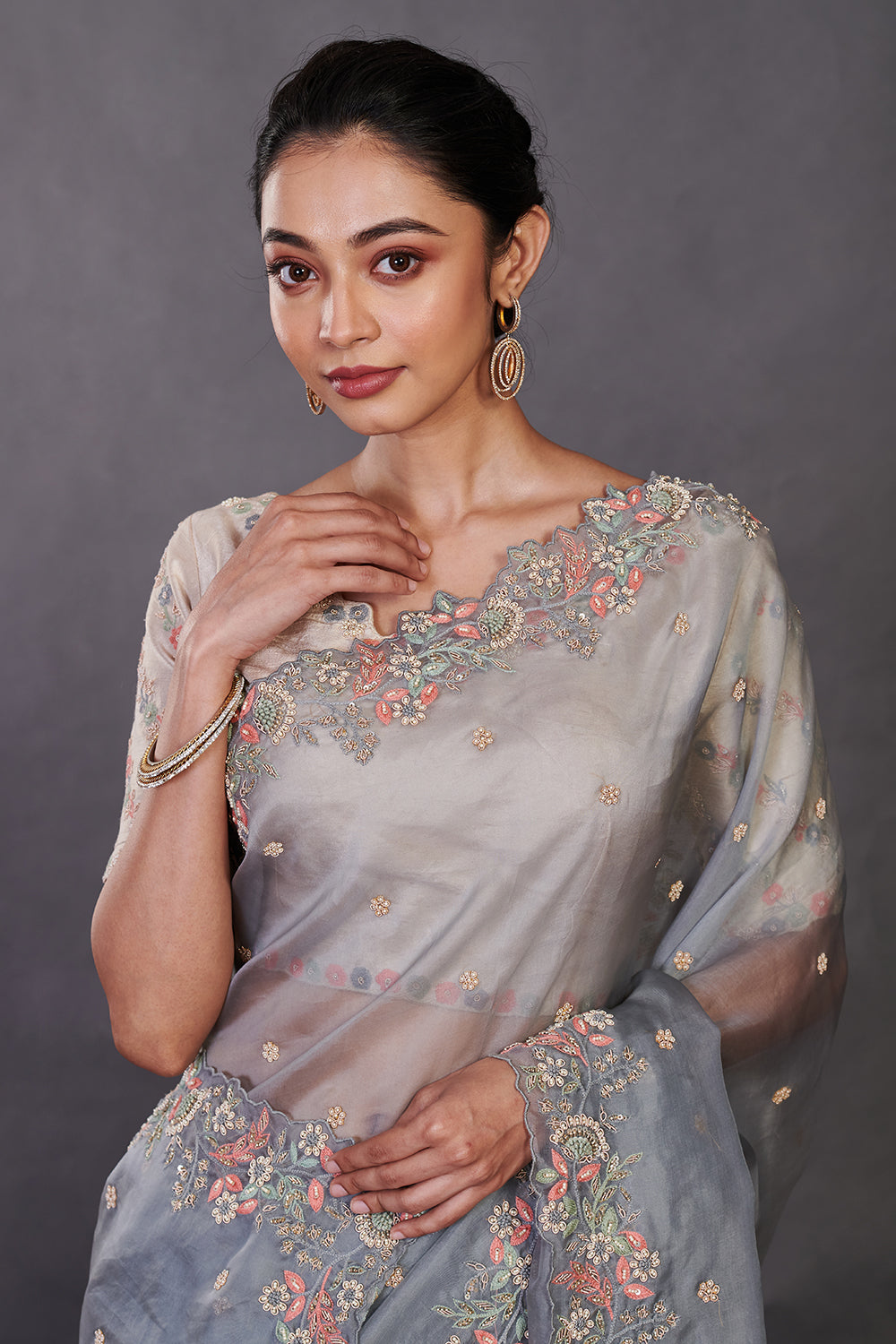 Shop beautiful grey hand embroidered organza sari online in USA with blouse. Make a fashion statement on festive occasions and weddings with designer sarees, designer suits, Indian dresses, Anarkali suits, palazzo suits, designer gowns, sharara suits, embroidered sarees from Pure Elegance Indian fashion store in USA.-closeup