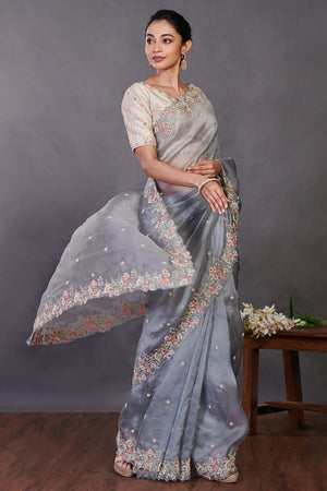 Shop beautiful grey hand embroidered organza sari online in USA with blouse. Make a fashion statement on festive occasions and weddings with designer sarees, designer suits, Indian dresses, Anarkali suits, palazzo suits, designer gowns, sharara suits, embroidered sarees from Pure Elegance Indian fashion store in USA.-saree