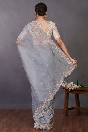 Shop beautiful grey hand embroidered organza sari online in USA with blouse. Make a fashion statement on festive occasions and weddings with designer sarees, designer suits, Indian dresses, Anarkali suits, palazzo suits, designer gowns, sharara suits, embroidered sarees from Pure Elegance Indian fashion store in USA.-back