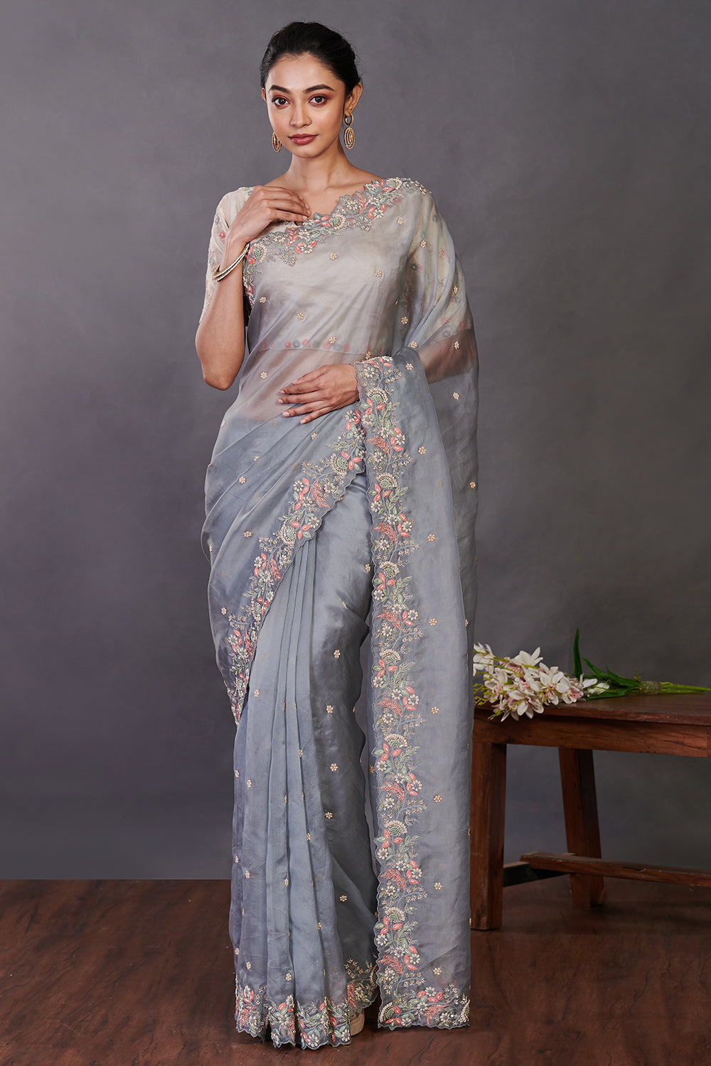Shop beautiful grey hand embroidered organza sari online in USA with blouse. Make a fashion statement on festive occasions and weddings with designer sarees, designer suits, Indian dresses, Anarkali suits, palazzo suits, designer gowns, sharara suits, embroidered sarees from Pure Elegance Indian fashion store in USA.-full view