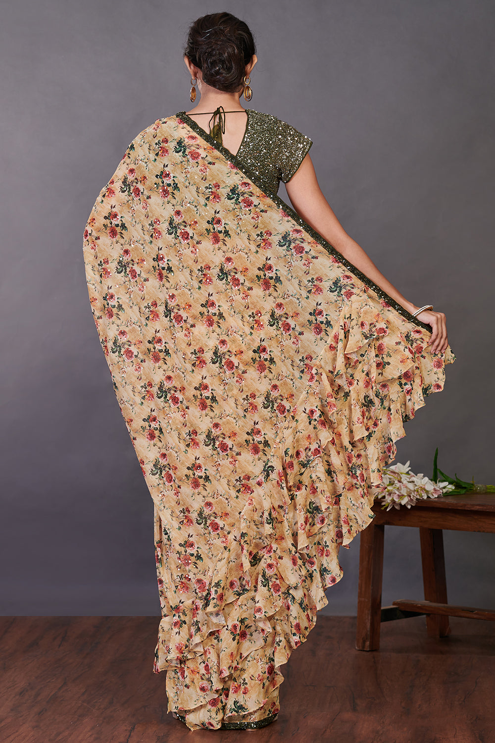Buy yellow floral print ruffle georgette sari online in USA with green blouse. Make a fashion statement on festive occasions and weddings with designer sarees, designer suits, Indian dresses, Anarkali suits, palazzo suits, designer gowns, sharara suits, embroidered sarees from Pure Elegance Indian fashion store in USA.-back