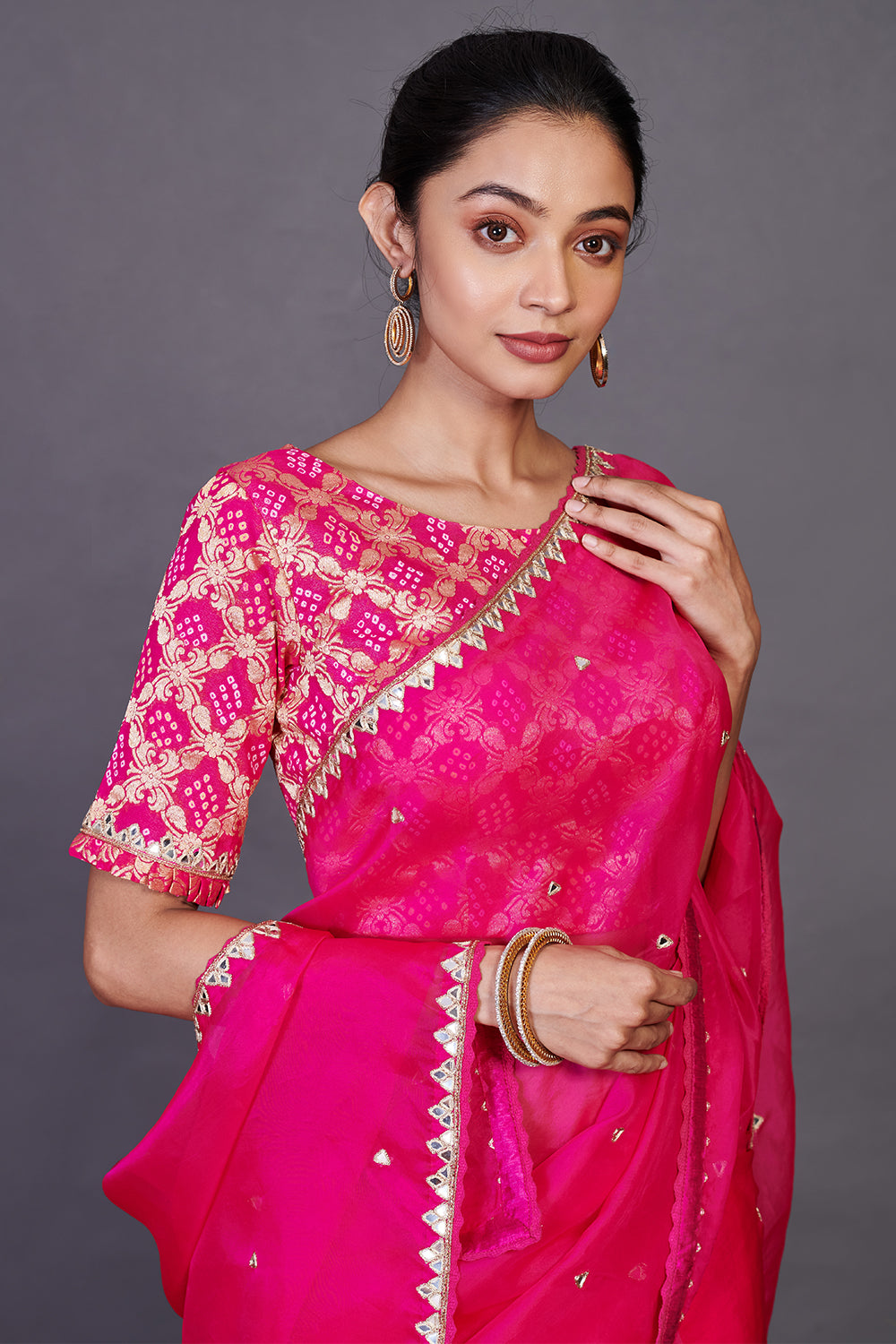 Buy stunning rani pink embroidered organza sari online in USA with blouse. Make a fashion statement on festive occasions and weddings with designer sarees, designer suits, Indian dresses, Anarkali suits, palazzo suits, designer gowns, sharara suits, embroidered sarees from Pure Elegance Indian fashion store in USA.-closeup