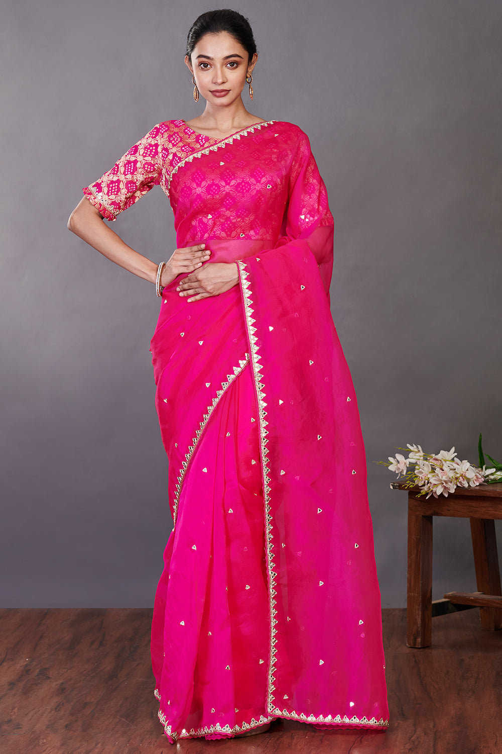 Buy stunning rani pink embroidered organza sari online in USA with blouse. Make a fashion statement on festive occasions and weddings with designer sarees, designer suits, Indian dresses, Anarkali suits, palazzo suits, designer gowns, sharara suits, embroidered sarees from Pure Elegance Indian fashion store in USA.-front