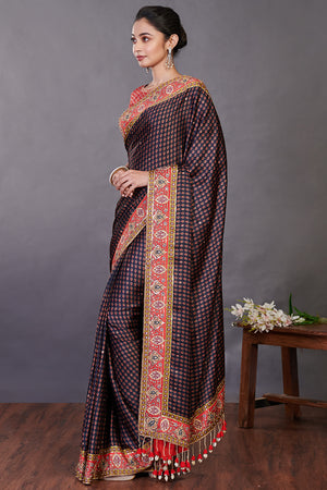 Shop beautiful black printed satin sari online in USA with kasab work. Make a fashion statement on festive occasions and weddings with designer sarees, designer suits, Indian dresses, Anarkali suits, palazzo suits, designer gowns, sharara suits, embroidered sarees from Pure Elegance Indian fashion store in USA.-pallu