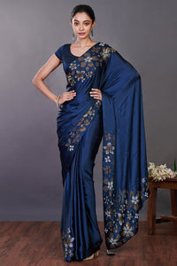Buy beautiful blue satin sari online in USA with Swarovski work and blouse. Make a fashion statement on festive occasions and weddings with designer sarees, designer suits, Indian dresses, Anarkali suits, palazzo suits, designer gowns, sharara suits, embroidered sarees from Pure Elegance Indian fashion store in USA.-full view