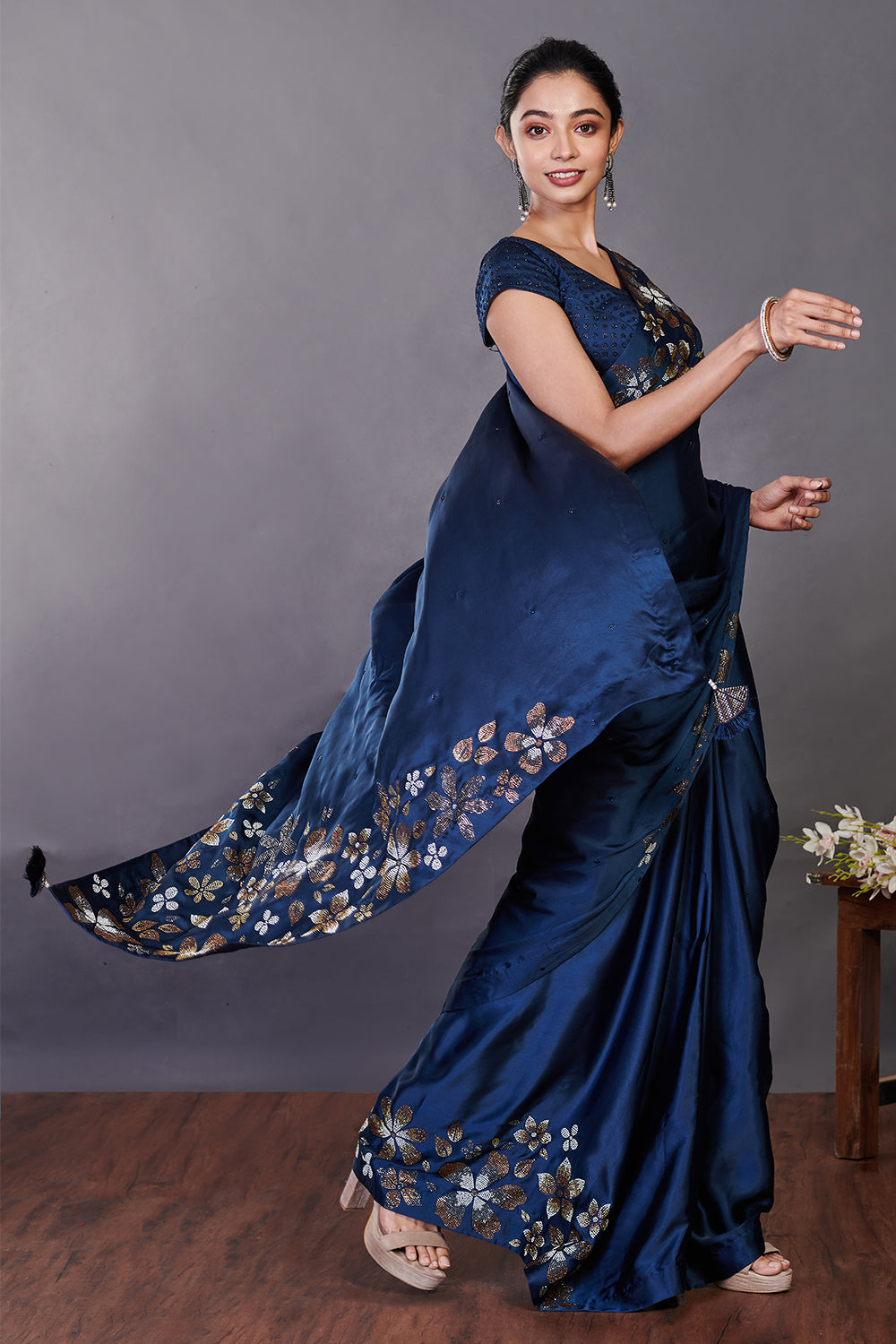 Buy beautiful blue satin sari online in USA with Swarovski work and blouse. Make a fashion statement on festive occasions and weddings with designer sarees, designer suits, Indian dresses, Anarkali suits, palazzo suits, designer gowns, sharara suits, embroidered sarees from Pure Elegance Indian fashion store in USA.-pallu
