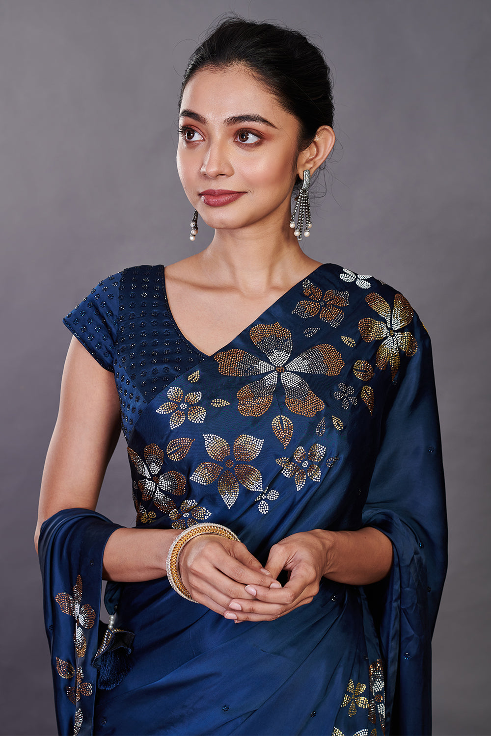 Buy beautiful blue satin sari online in USA with Swarovski work and blouse. Make a fashion statement on festive occasions and weddings with designer sarees, designer suits, Indian dresses, Anarkali suits, palazzo suits, designer gowns, sharara suits, embroidered sarees from Pure Elegance Indian fashion store in USA.-closeup