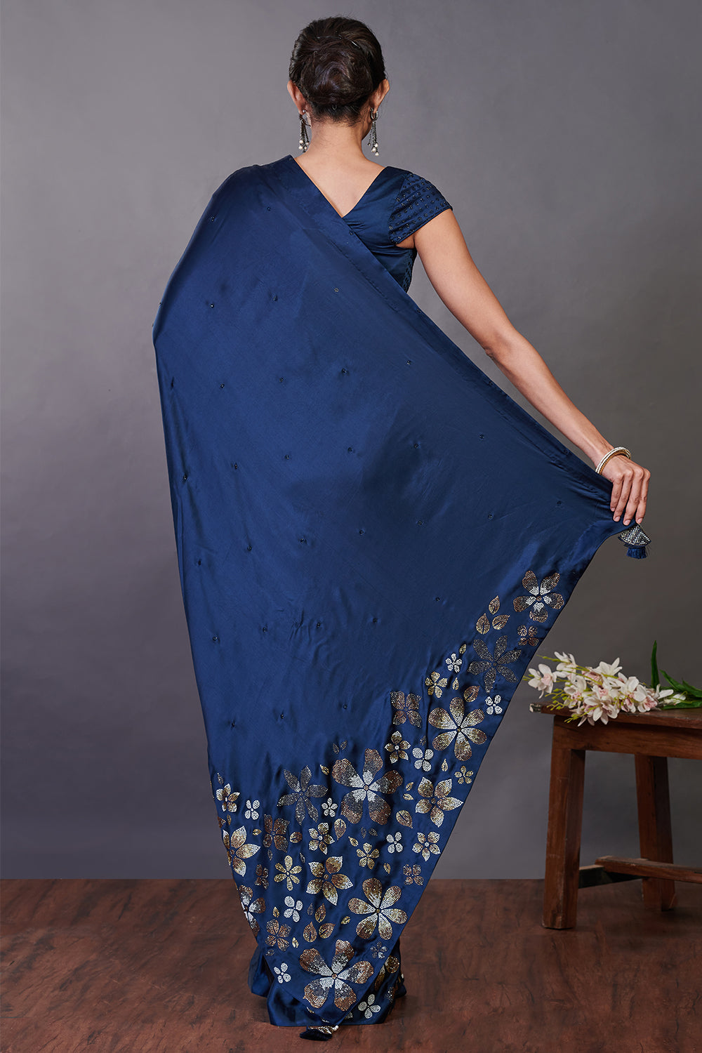 Buy beautiful blue satin sari online in USA with Swarovski work and blouse. Make a fashion statement on festive occasions and weddings with designer sarees, designer suits, Indian dresses, Anarkali suits, palazzo suits, designer gowns, sharara suits, embroidered sarees from Pure Elegance Indian fashion store in USA.-back