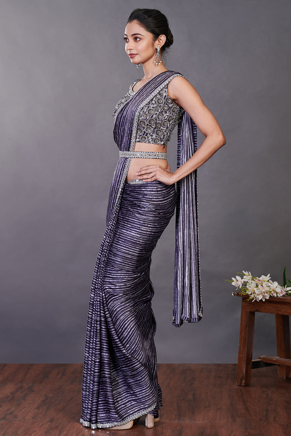 Shop deep purple satin printed sequin work sari online in USA with belt. Make a fashion statement on festive occasions and weddings with designer sarees, designer suits, Indian dresses, Anarkali suits, palazzo suits, designer gowns, sharara suits, embroidered sarees from Pure Elegance Indian fashion store in USA.-right