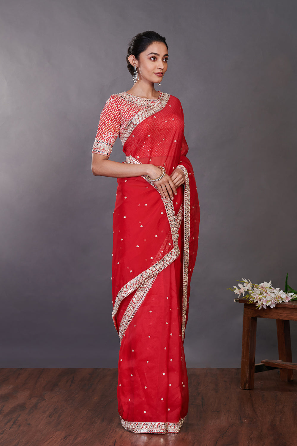 Shop red mirror work organza sari online in USA with designer blouse. Make a fashion statement on festive occasions and weddings with designer sarees, designer suits, Indian dresses, Anarkali suits, palazzo suits, designer gowns, sharara suits, embroidered sarees from Pure Elegance Indian fashion store in USA.-side