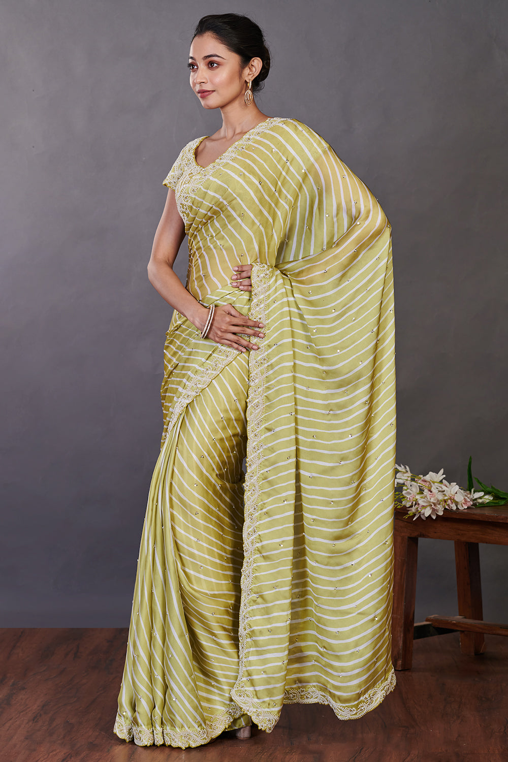 Buy beautiful pista green printed satin sari online in USA with bead work. Make a fashion statement on festive occasions and weddings with designer sarees, designer suits, Indian dresses, Anarkali suits, palazzo suits, designer gowns, sharara suits, embroidered sarees from Pure Elegance Indian fashion store in USA.-pallu
