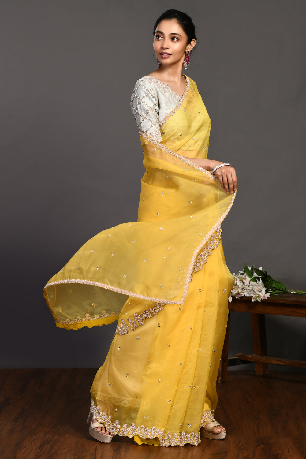 Buy beautiful yellow hand embroidered organza sari online in USA with bead work. Make a fashion statement on festive occasions and weddings with designer sarees, designer suits, Indian dresses, Anarkali suits, palazzo suits, designer gowns, sharara suits, embroidered sarees from Pure Elegance Indian fashion store in USA.-side