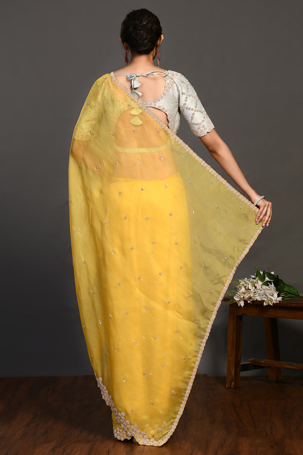 Buy beautiful yellow hand embroidered organza sari online in USA with bead work. Make a fashion statement on festive occasions and weddings with designer sarees, designer suits, Indian dresses, Anarkali suits, palazzo suits, designer gowns, sharara suits, embroidered sarees from Pure Elegance Indian fashion store in USA.-back