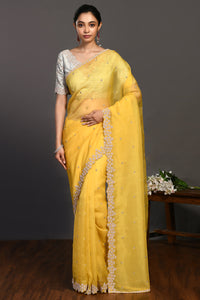 Buy beautiful yellow hand embroidered organza sari online in USA with bead work. Make a fashion statement on festive occasions and weddings with designer sarees, designer suits, Indian dresses, Anarkali suits, palazzo suits, designer gowns, sharara suits, embroidered sarees from Pure Elegance Indian fashion store in USA.-full view