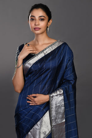 Buy beautiful navy blue handloom sari online in USA with silver zari border. Make a fashion statement on festive occasions and weddings with designer sarees, designer suits, Indian dresses, Anarkali suits, palazzo suits, designer gowns, sharara suits, embroidered sarees from Pure Elegance Indian fashion store in USA.-closeup