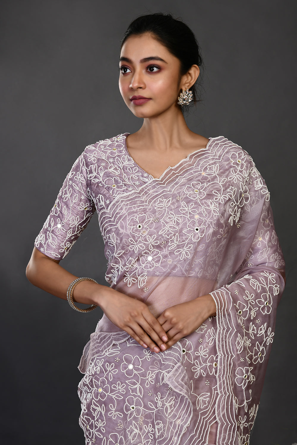 Buy stunning mauve pearl and mirror work organza sari online in USA. Make a fashion statement on festive occasions and weddings with designer sarees, designer suits, Indian dresses, Anarkali suits, palazzo suits, designer gowns, sharara suits, embroidered sarees from Pure Elegance Indian fashion store in USA.-closeup