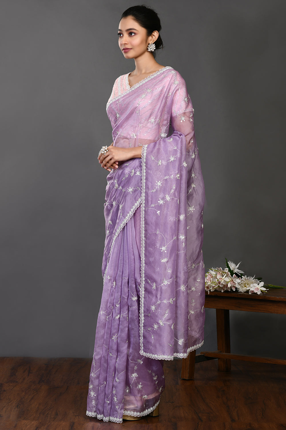 Shop beautiful lavender stone and zari work organza sari online in USA. Make a fashion statement on festive occasions and weddings with designer sarees, designer suits, Indian dresses, Anarkali suits, palazzo suits, designer gowns, sharara suits, embroidered sarees from Pure Elegance Indian fashion store in USA.-pallu