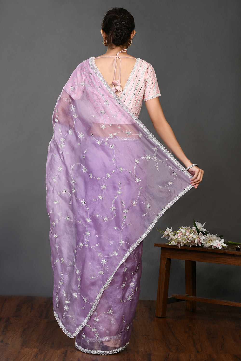 Shop beautiful lavender stone and zari work organza sari online in USA. Make a fashion statement on festive occasions and weddings with designer sarees, designer suits, Indian dresses, Anarkali suits, palazzo suits, designer gowns, sharara suits, embroidered sarees from Pure Elegance Indian fashion store in USA.-back