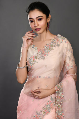 Buy stunning peach pearl and resham work organza sari online in USA. Make a fashion statement on festive occasions and weddings with designer sarees, designer suits, Indian dresses, Anarkali suits, palazzo suits, designer gowns, sharara suits, embroidered sarees from Pure Elegance Indian fashion store in USA.-closeup