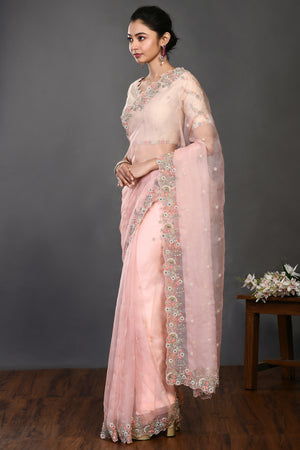 Buy stunning peach pearl and resham work organza sari online in USA. Make a fashion statement on festive occasions and weddings with designer sarees, designer suits, Indian dresses, Anarkali suits, palazzo suits, designer gowns, sharara suits, embroidered sarees from Pure Elegance Indian fashion store in USA.-pallu