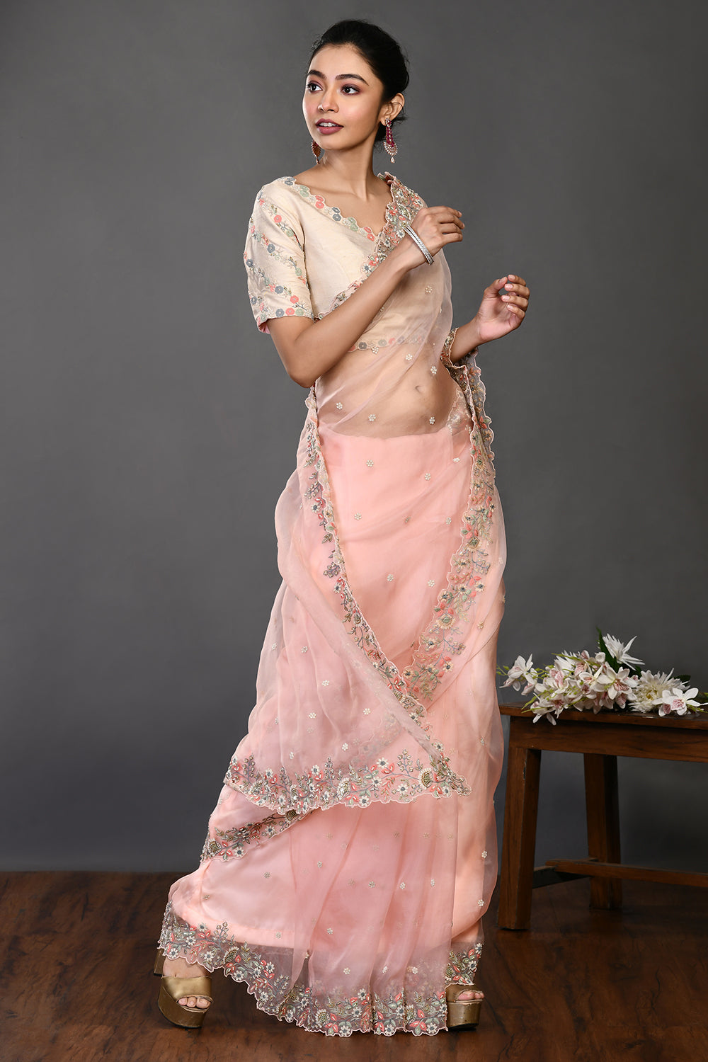 Buy stunning peach pearl and resham work organza sari online in USA. Make a fashion statement on festive occasions and weddings with designer sarees, designer suits, Indian dresses, Anarkali suits, palazzo suits, designer gowns, sharara suits, embroidered sarees from Pure Elegance Indian fashion store in USA.-side