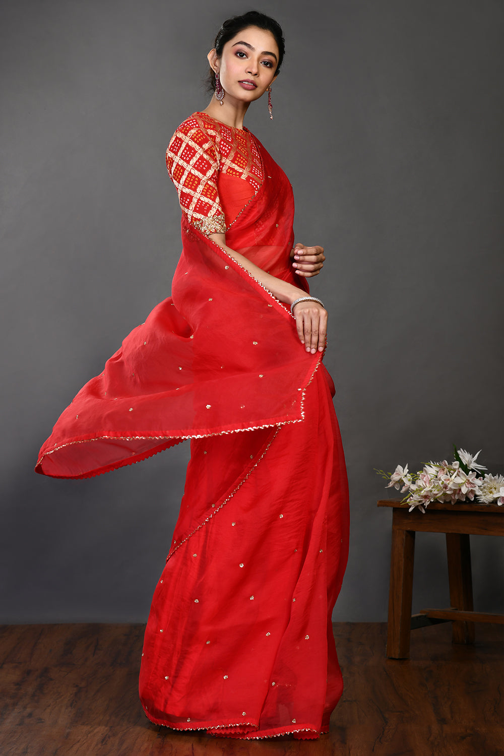Buy red embroidered organza sari online in USA with Banarasi blouse. Make a fashion statement on festive occasions and weddings with designer sarees, designer suits, Indian dresses, Anarkali suits, palazzo suits, designer gowns, sharara suits, embroidered sarees from Pure Elegance Indian fashion store in USA.-side