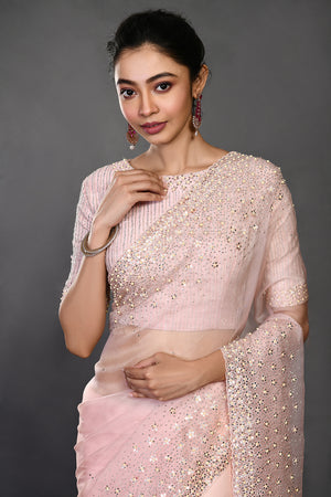 Shop powder pink embroidered organza sari online in USA with blouse. Make a fashion statement on festive occasions and weddings with designer sarees, designer suits, Indian dresses, Anarkali suits, palazzo suits, designer gowns, sharara suits, embroidered sarees from Pure Elegance Indian fashion store in USA.-closeup