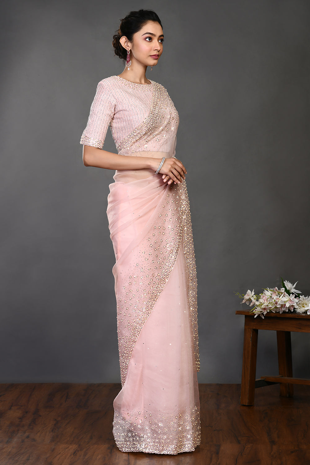Shop powder pink embroidered organza sari online in USA with blouse. Make a fashion statement on festive occasions and weddings with designer sarees, designer suits, Indian dresses, Anarkali suits, palazzo suits, designer gowns, sharara suits, embroidered sarees from Pure Elegance Indian fashion store in USA.-side