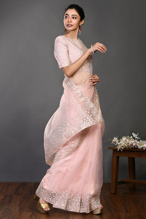 Shop powder pink embroidered organza sari online in USA with blouse. Make a fashion statement on festive occasions and weddings with designer sarees, designer suits, Indian dresses, Anarkali suits, palazzo suits, designer gowns, sharara suits, embroidered sarees from Pure Elegance Indian fashion store in USA.-saree