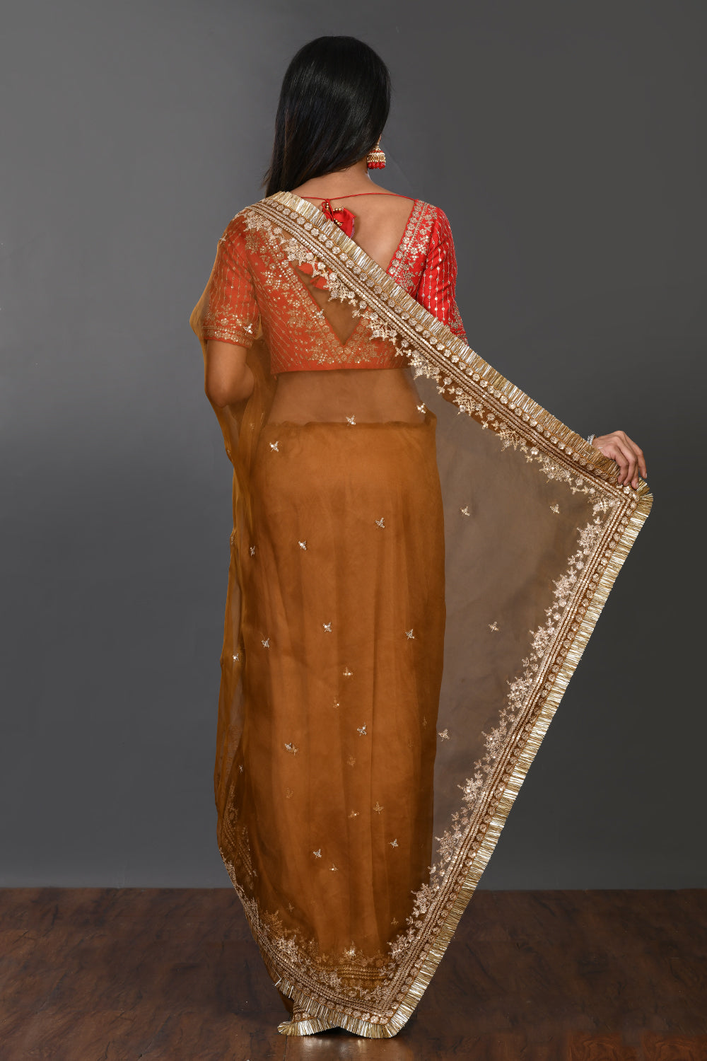 Buy brown tikki work organza sari online in USA with kiran lace and blouse. Make a fashion statement on festive occasions and weddings with designer sarees, designer suits, Indian dresses, Anarkali suits, palazzo suits, designer gowns, sharara suits, embroidered sarees from Pure Elegance Indian fashion store in USA.-back