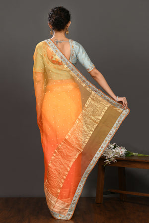 Buy yellow and orange hand embroidered organza sari online in USA with grey blouse. Make a fashion statement on festive occasions and weddings with designer sarees, designer suits, Indian dresses, Anarkali suits, palazzo suits, designer gowns, sharara suits, embroidered sarees from Pure Elegance Indian fashion store in USA.-back
