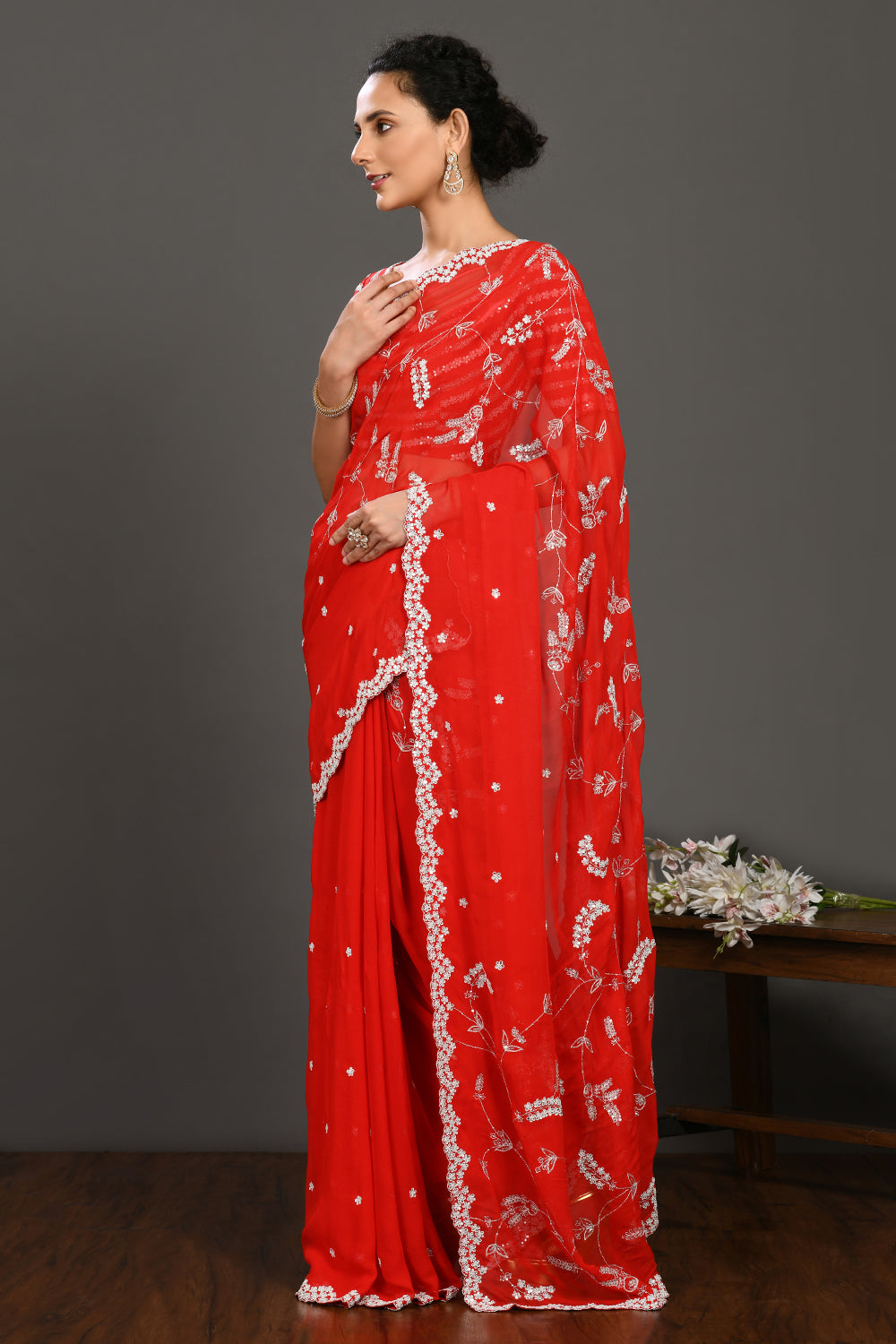 Shop red embroidered georgette sari online in USA with blouse. Make a fashion statement on festive occasions and weddings with designer sarees, designer suits, Indian dresses, Anarkali suits, palazzo suits, designer gowns, sharara suits, embroidered sarees from Pure Elegance Indian fashion store in USA.-pallu