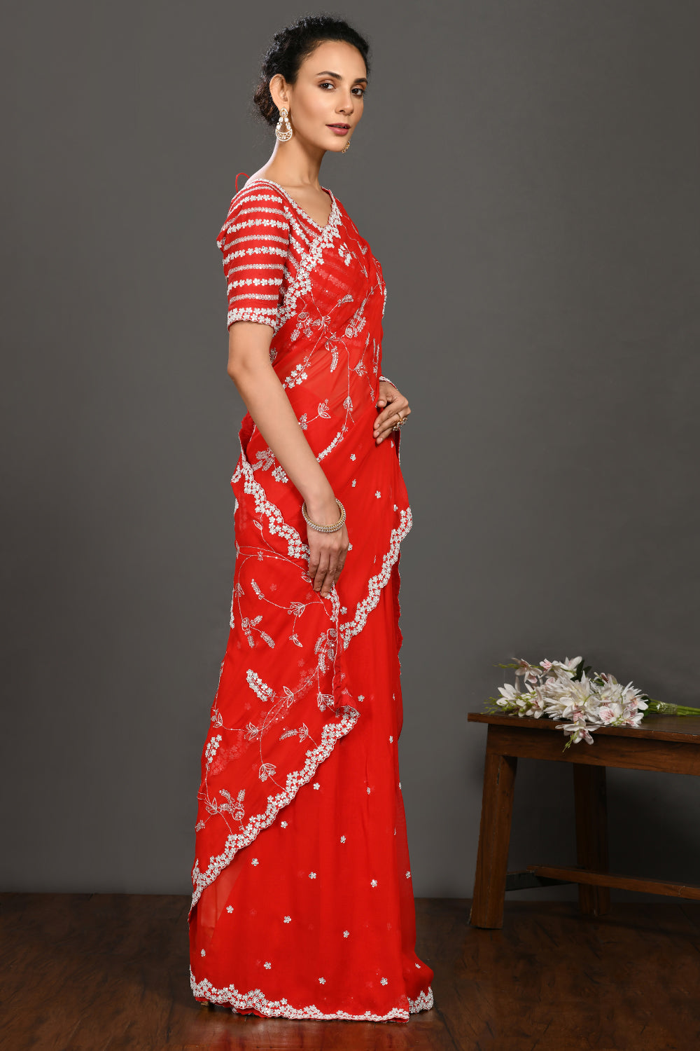 Shop red embroidered georgette sari online in USA with blouse. Make a fashion statement on festive occasions and weddings with designer sarees, designer suits, Indian dresses, Anarkali suits, palazzo suits, designer gowns, sharara suits, embroidered sarees from Pure Elegance Indian fashion store in USA.-side