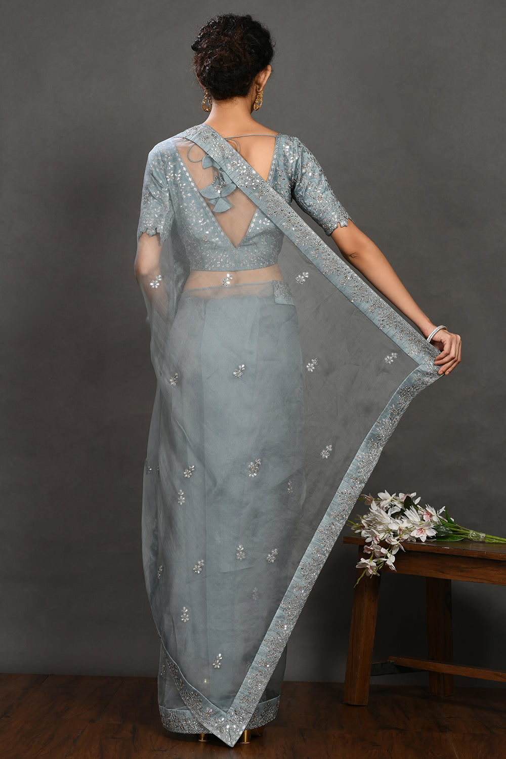 Shop teal blue embroidered organza sari online in USA with blouse. Make a fashion statement on festive occasions and weddings with designer sarees, designer suits, Indian dresses, Anarkali suits, palazzo suits, designer gowns, sharara suits, embroidered sarees from Pure Elegance Indian fashion store in USA.-back