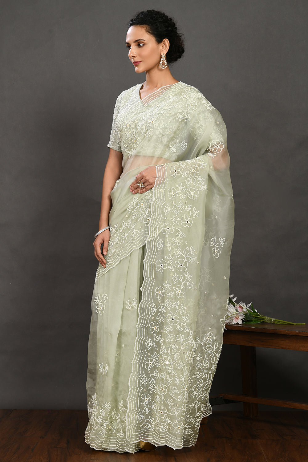 Shop pista green pearl and mirror work organza sari online in USA with blouse. Make a fashion statement on festive occasions and weddings with designer sarees, designer suits, Indian dresses, Anarkali suits, palazzo suits, designer gowns, sharara suits, embroidered sarees from Pure Elegance Indian fashion store in USA.-pallu