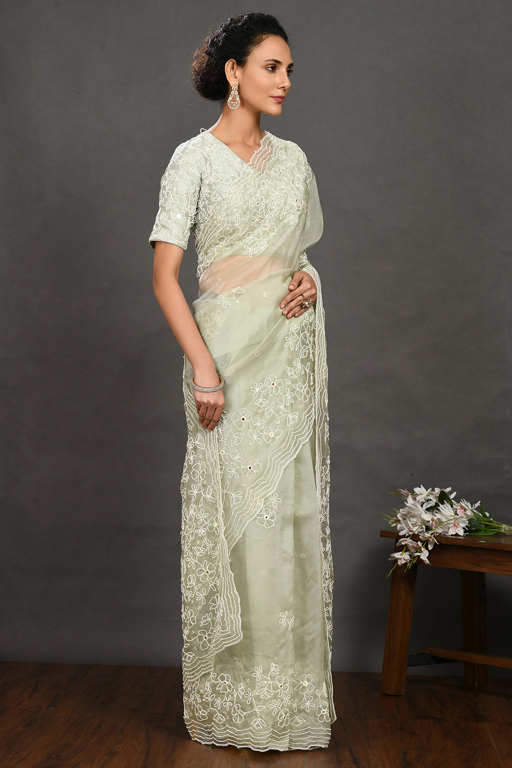 Shop pista green pearl and mirror work organza sari online in USA with blouse. Make a fashion statement on festive occasions and weddings with designer sarees, designer suits, Indian dresses, Anarkali suits, palazzo suits, designer gowns, sharara suits, embroidered sarees from Pure Elegance Indian fashion store in USA.-right