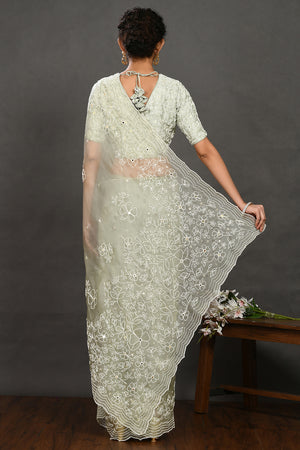 Shop pista green pearl and mirror work organza sari online in USA with blouse. Make a fashion statement on festive occasions and weddings with designer sarees, designer suits, Indian dresses, Anarkali suits, palazzo suits, designer gowns, sharara suits, embroidered sarees from Pure Elegance Indian fashion store in USA.-back