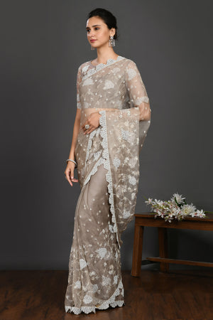 Buy grey stone and pearl work organza sari online in USA with blouse. Make a fashion statement on festive occasions and weddings with designer sarees, designer suits, Indian dresses, Anarkali suits, palazzo suits, designer gowns, sharara suits, embroidered sarees from Pure Elegance Indian fashion store in USA.-pallu