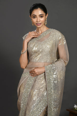 Buy grey stone and cutdana work organza sari online in USA with blouse. Make a fashion statement on festive occasions and weddings with designer sarees, designer suits, Indian dresses, Anarkali suits, palazzo suits, designer gowns, sharara suits, embroidered sarees from Pure Elegance Indian fashion store in USA.-closeup