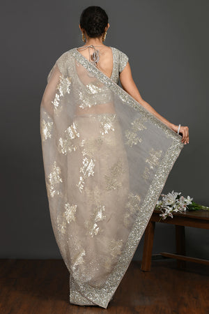Buy grey stone and cutdana work organza sari online in USA with blouse. Make a fashion statement on festive occasions and weddings with designer sarees, designer suits, Indian dresses, Anarkali suits, palazzo suits, designer gowns, sharara suits, embroidered sarees from Pure Elegance Indian fashion store in USA.-back
