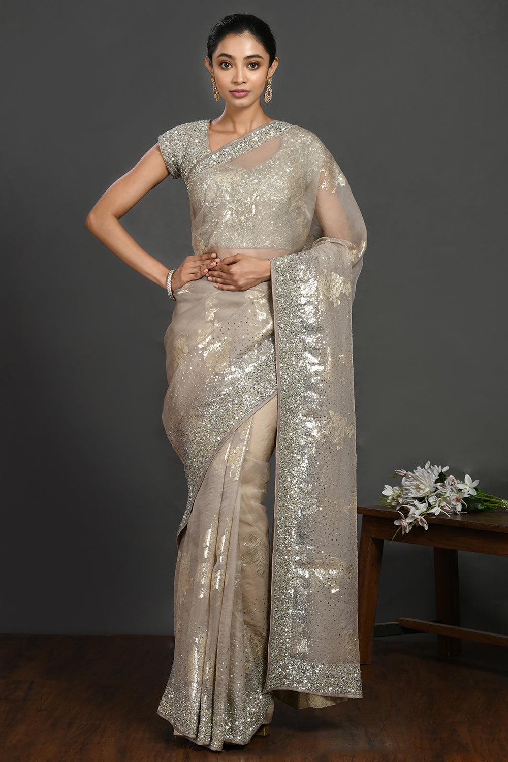 Buy grey stone and cutdana work organza sari online in USA with blouse. Make a fashion statement on festive occasions and weddings with designer sarees, designer suits, Indian dresses, Anarkali suits, palazzo suits, designer gowns, sharara suits, embroidered sarees from Pure Elegance Indian fashion store in USA.-full view