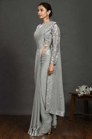 Buy grey mirror and resham work georgette belted sari online in USA. Make a fashion statement on festive occasions and weddings with designer sarees, designer suits, Indian dresses, Anarkali suits, palazzo suits, designer gowns, sharara suits, embroidered sarees from Pure Elegance Indian fashion store in USA.-pallu