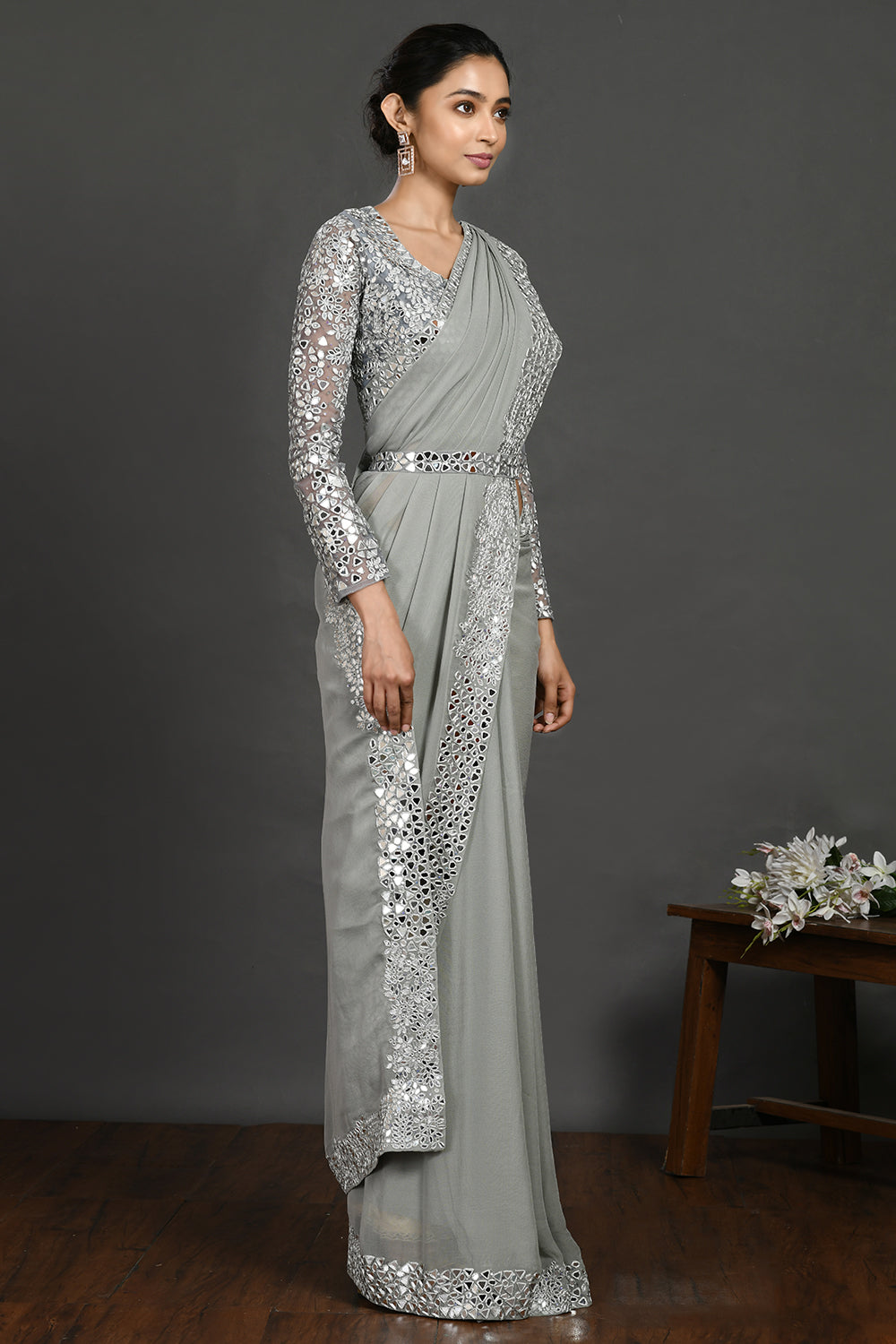 Buy grey mirror and resham work georgette belted sari online in USA. Make a fashion statement on festive occasions and weddings with designer sarees, designer suits, Indian dresses, Anarkali suits, palazzo suits, designer gowns, sharara suits, embroidered sarees from Pure Elegance Indian fashion store in USA.-side