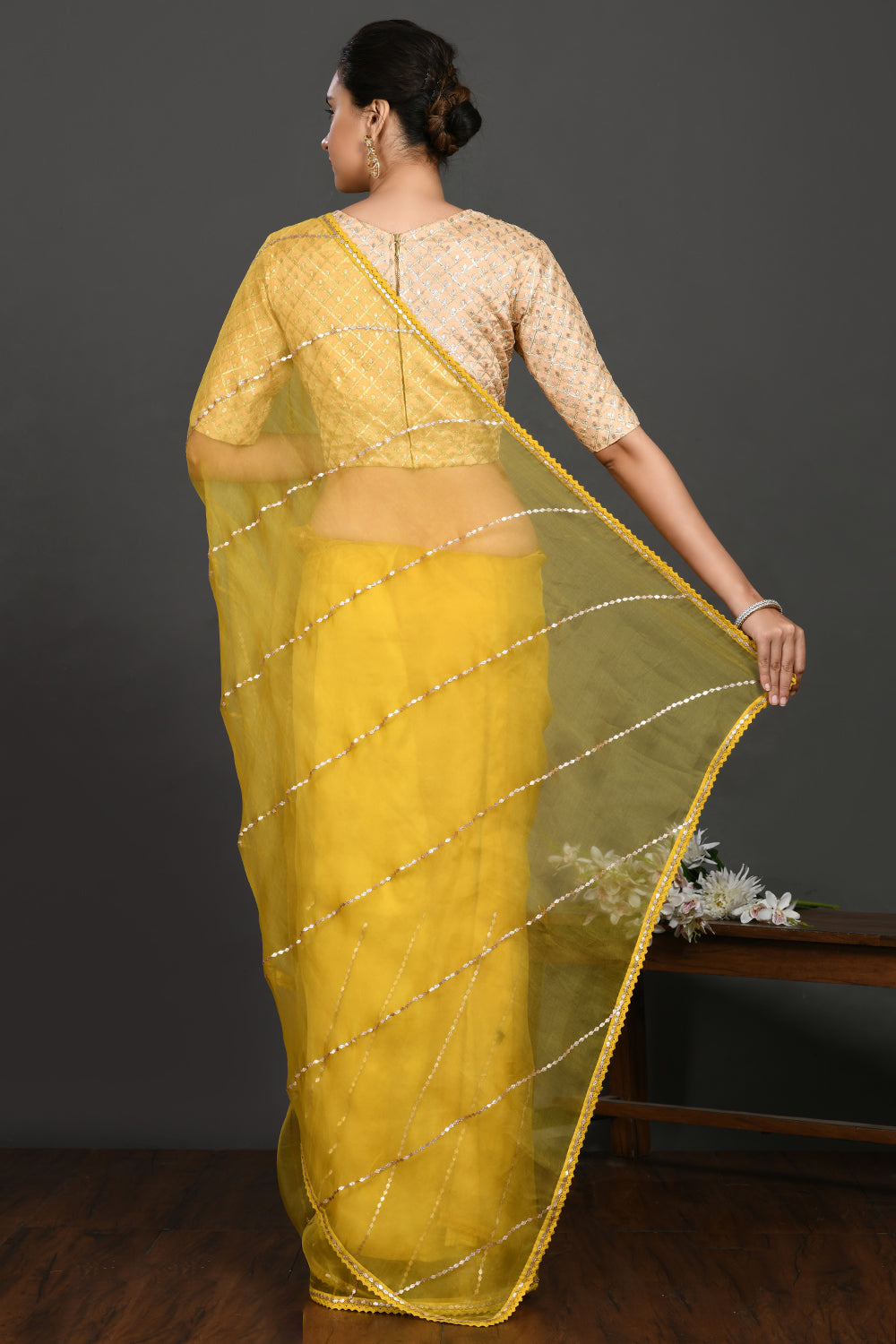 Shop yellow gota work organza sari online in USA with blouse. Make a fashion statement on festive occasions and weddings with designer sarees, designer suits, Indian dresses, Anarkali suits, palazzo suits, designer gowns, sharara suits, embroidered sarees from Pure Elegance Indian fashion store in USA.-back