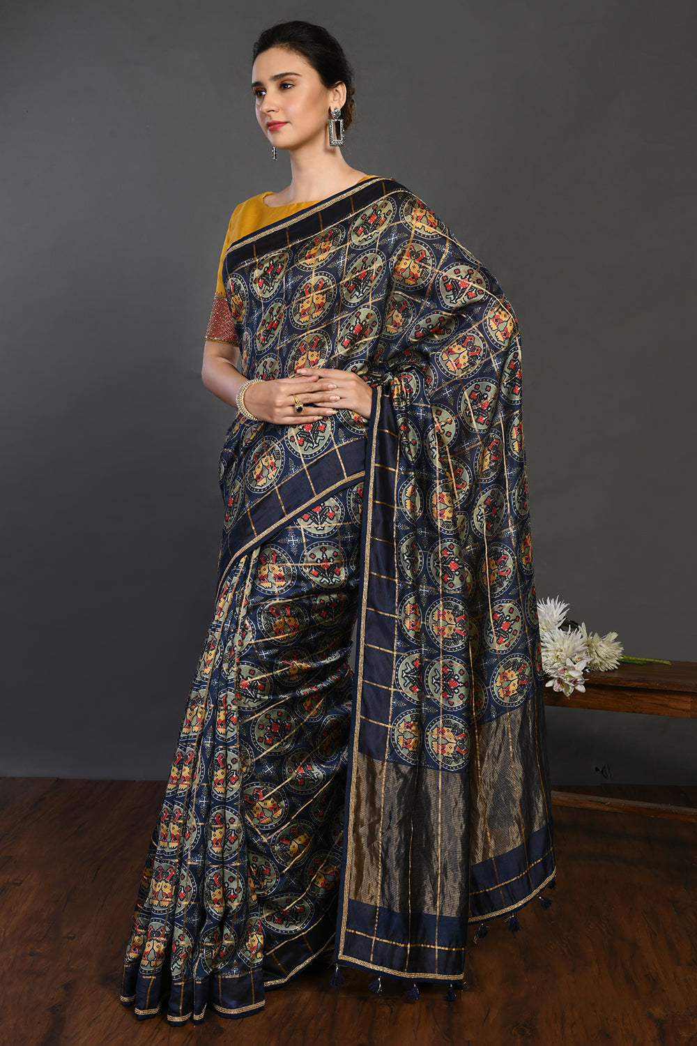 Buy navy blue printed handloom sari online in USA with yellow blouse. Make a fashion statement on festive occasions and weddings with designer sarees, designer suits, Indian dresses, Anarkali suits, palazzo suits, designer gowns, sharara suits, embroidered sarees from Pure Elegance Indian fashion store in USA.-pallu