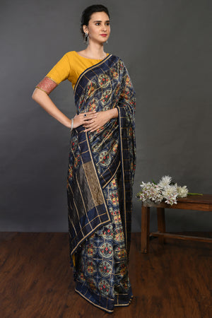 Buy navy blue printed handloom sari online in USA with yellow blouse. Make a fashion statement on festive occasions and weddings with designer sarees, designer suits, Indian dresses, Anarkali suits, palazzo suits, designer gowns, sharara suits, embroidered sarees from Pure Elegance Indian fashion store in USA.-right