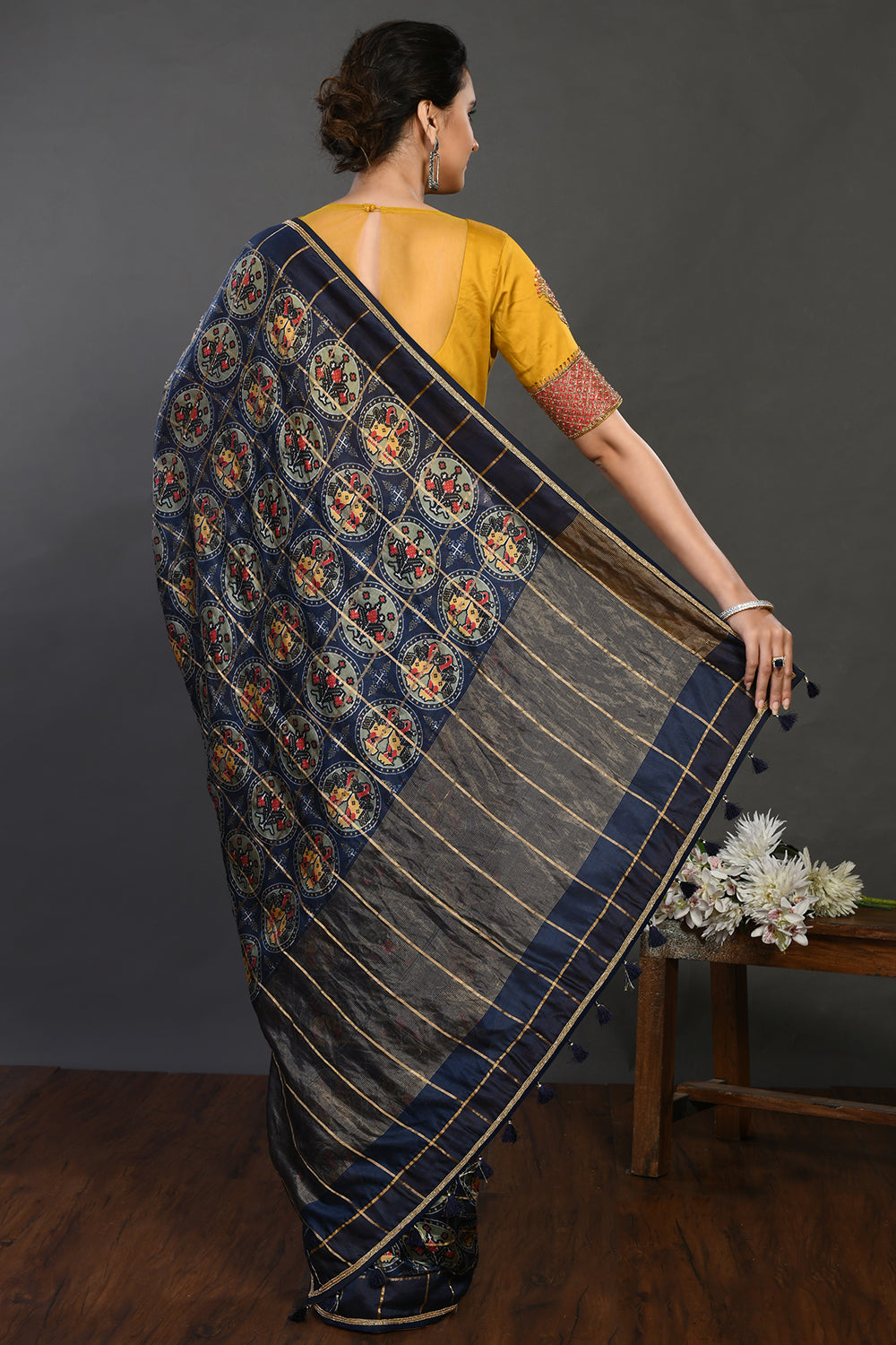 Buy navy blue printed handloom sari online in USA with yellow blouse. Make a fashion statement on festive occasions and weddings with designer sarees, designer suits, Indian dresses, Anarkali suits, palazzo suits, designer gowns, sharara suits, embroidered sarees from Pure Elegance Indian fashion store in USA.-back